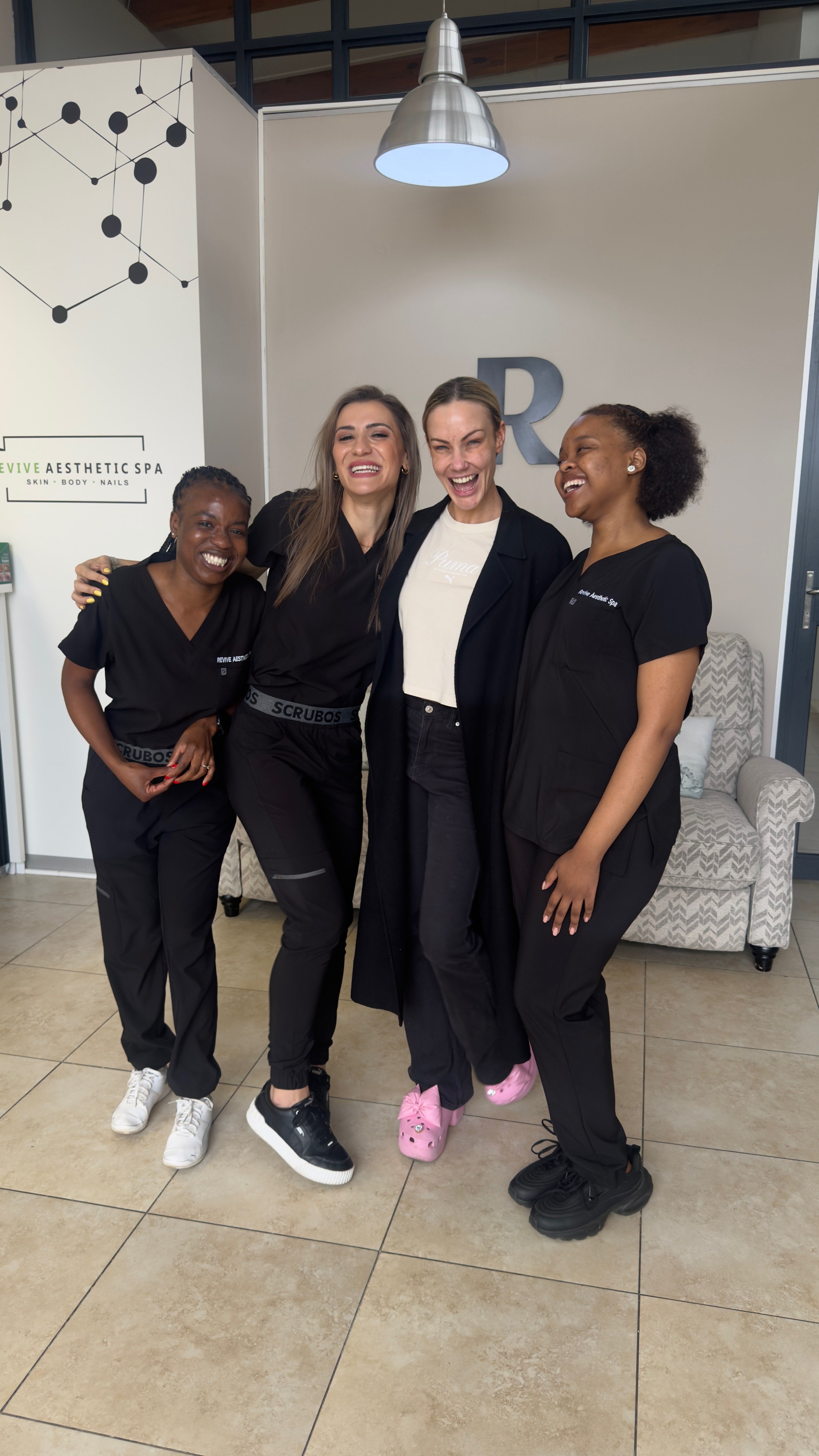 The Revive Aesthetic Spa team sharing a laugh together